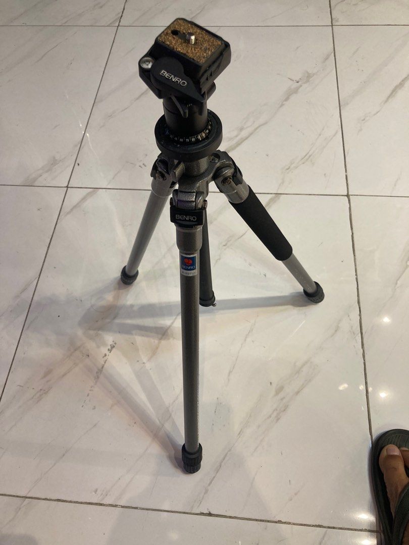 Benro A-027 Tripod with Carrying Case (Category: Tripods & Monopods) located in Quezon City. Submitted by janisu0303 (Listing ID 1402466458, Image 1). Description: Benro A-027 tripod Good condition Fairview area meetups Or shipping 3500 php only Tripod features a ball head and adjustable legs. The model number is A-027n0. It has a black handle on one of the legs. The tripod is silver and black in color. The carrying case is black..