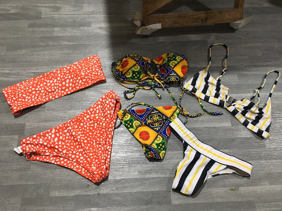 Bikini Sets - Various Designs (Category: Bikinis & Swimsuits) located in Mandaluyong City. Submitted by needs99 (Listing ID 1402410073, Image 1). Description: - Assorted bikini sets available. - Includes: - Red and white patterned bandeau top and bottom set. - Patterned bikini top and bottom set. - Black, white, and yellow striped bikini set. *Only the stripe one i wear once the rest is brandnew.