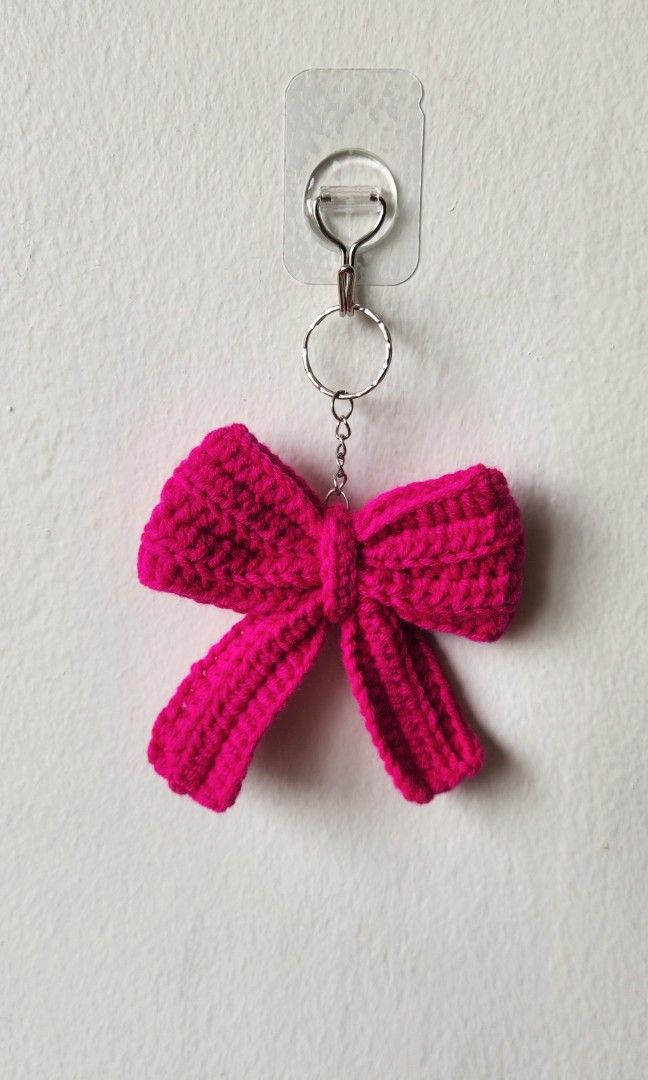 Bow keychains (Category: Handmade Craft) located in Singapore. Submitted by mojinacrochet (Listing ID 1402291546, Image 1). Description: made with milk cotton yarn can be custom made in other colours bulk orders can be done.