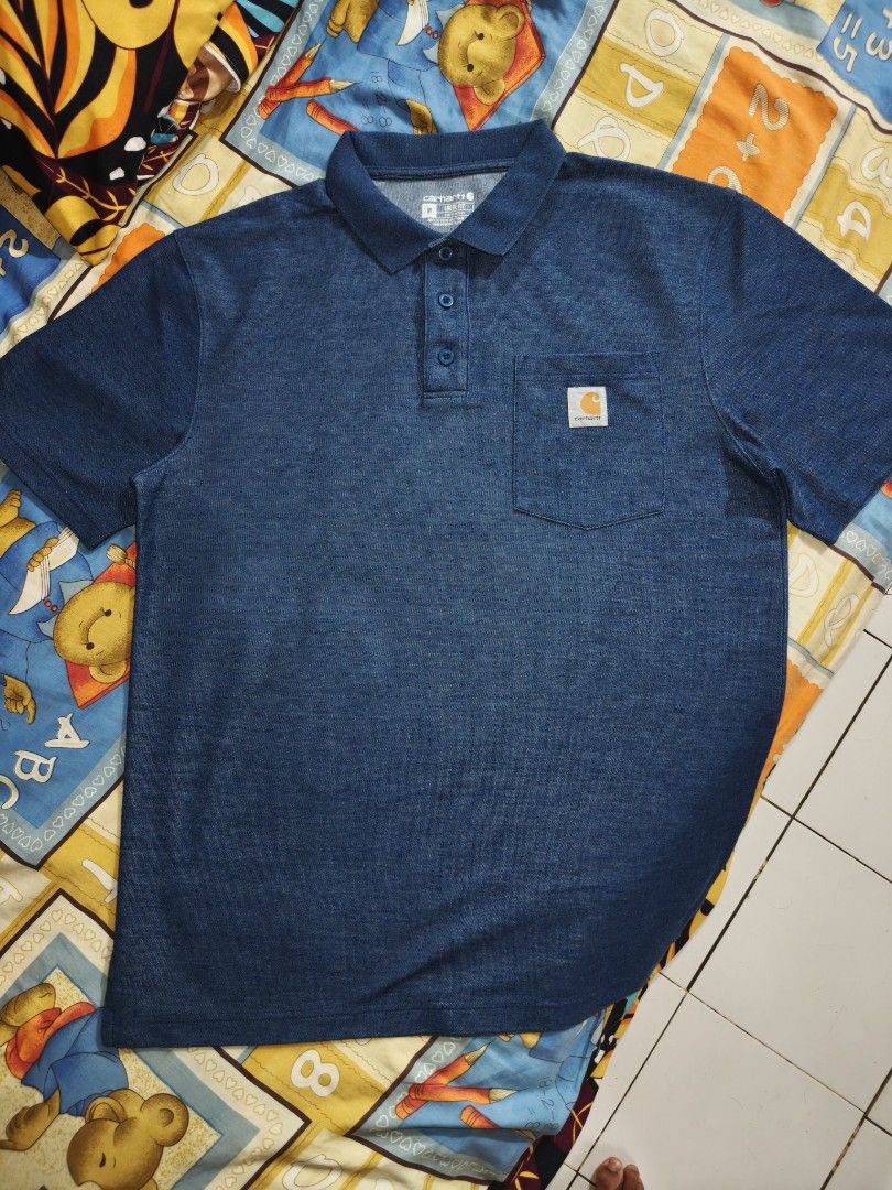 Carhartt Pocket Polo Shirt (Category: Tshirts & Polo Shirts ) located in Caloocan City. Submitted by zediee (Listing ID 1402365744, Image 1). Description: - Carhartt polo shirt - Classic design - Solid blue color - Chest pocket with Carhartt logo - Collared neckline - Three-button placket - Comfortable and breathable fabric - Dimes 22 - 29.