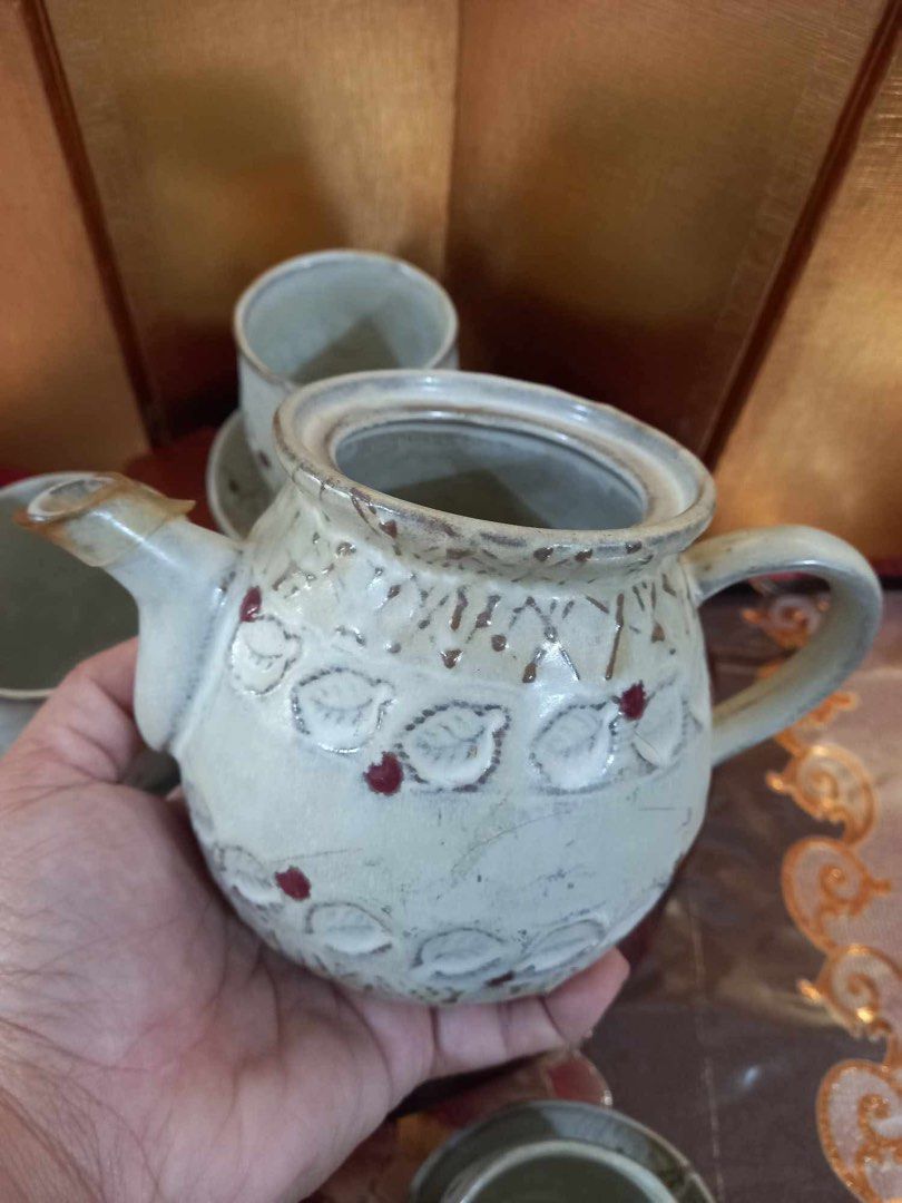 Ceramic Stoneware Aito Ware Tea Set with Teapot and Cups (Category: Coffee & Tea Tableware) located in Naga. Submitted by happeemarket (Listing ID 1402351680, Image 3). Description: Ceramic Stoneware Aito Ware Tea Set with Teapot and Cups -An AitoTea Set from Japan - Ceramic tea set - Includes teapot, 4 cups, and saucers - Cream-colored glaze - Features leaf and berry designs - Handmade, rustic aesthetic - Perfect for serving tea - no sign of usa