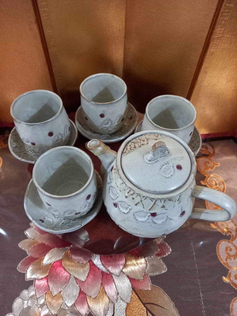 Ceramic Stoneware Aito Ware Tea Set with Teapot and Cups (Category: Coffee & Tea Tableware) located in Naga. Submitted by happeemarket (Listing ID 1402351680, Image 2). Description: Ceramic Stoneware Aito Ware Tea Set with Teapot and Cups -An AitoTea Set from Japan - Ceramic tea set - Includes teapot, 4 cups, and saucers - Cream-colored glaze - Features leaf and berry designs - Handmade, rustic aesthetic - Perfect for serving tea - no sign of usa