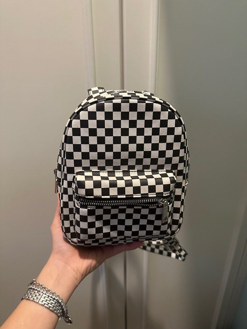 Checkered small Backpack (Category: Backpacks) located in Klang. Submitted by bluupyy (Listing ID 1402396124, Image 2). Description: Condition is good no yellowing or scratches Straps are adjustable Zippers work perfect Pm for more pictures .