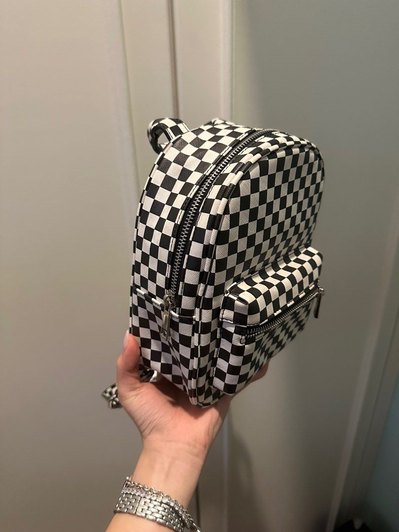Checkered small Backpack (Category: Backpacks) located in Klang. Submitted by bluupyy (Listing ID 1402396124, Image 3). Description: Condition is good no yellowing or scratches Straps are adjustable Zippers work perfect Pm for more pictures .