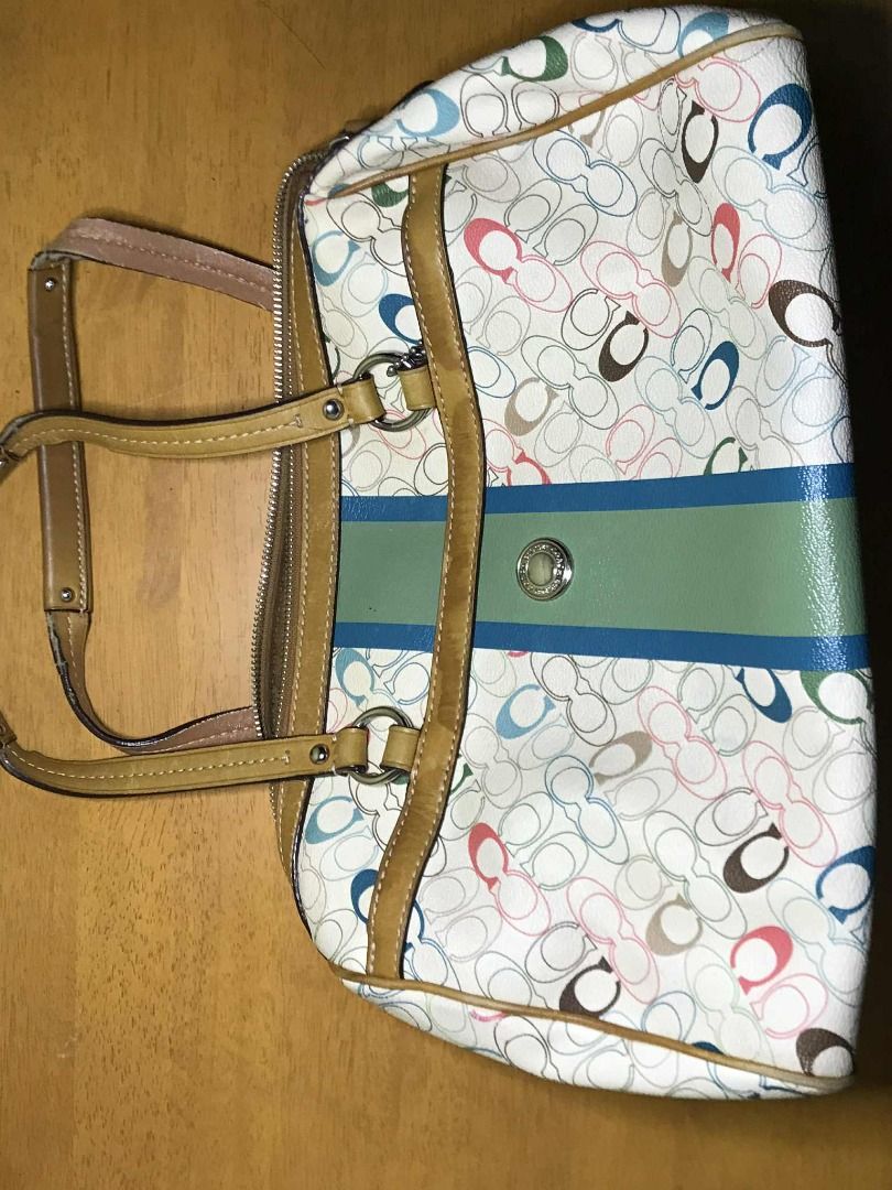 Coach Signature Handbag (Category: Luxury Bags & Wallets) located in Manila. Submitted by jaceiz (Listing ID 1402430273, Image 3). Description: - Coach signature handbag - Colorful pattern - Zip closure - Brown interior with pocket - Includes Coach tag - Brown leather trim and handles - Green and blue stripe design.
