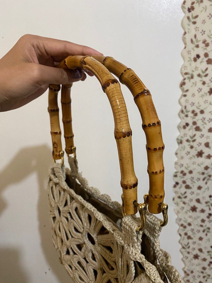 Crochet Floral Handbag with Bamboo Handle (Category: Tote Bags) located in Baguio. Submitted by leeala (Listing ID 1402334156, Image 2). Description: - Crochet floral design - Bamboo handles - Gold-colored hardware - Satin-lined interior - Drawstring closure - Neutral color.