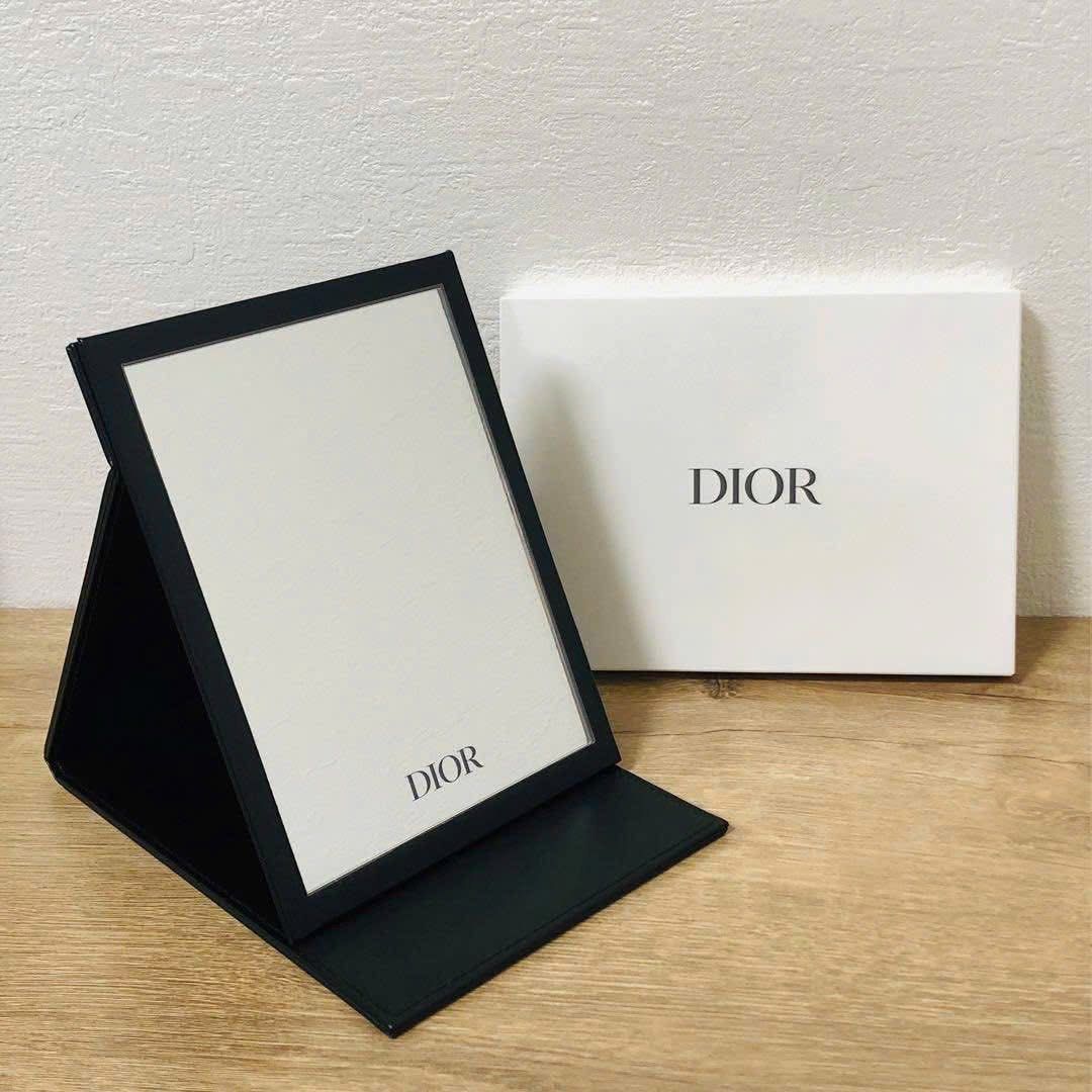Dior Compact Mirror (Category: Mirrors) located in Imus. Submitted by diana2999 (Listing ID 1402462729, Image 3). Description: - Authentic Dior compact mirror - Features a black, leather-like exterior - Adorned with the iconic Dior logo - Mirror protected by a plastic film - Perfect for on-the-go touch-ups Eta: November 25 +200 for paperbag .