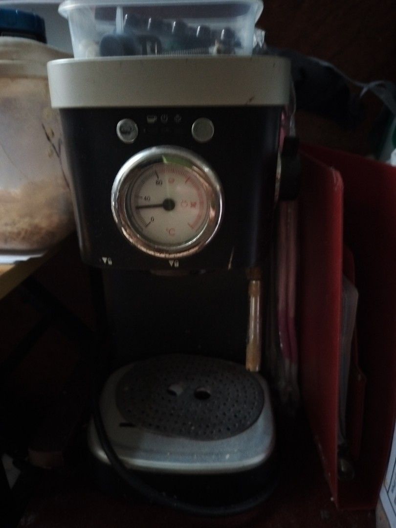 Espresso Machine (Category: Coffee Machines & Makers) located in Quezon City. Submitted by jhenreiner (Listing ID 1402290628, Image 1). Description: - Espresso machine with pressure gauge - Stylish black and white design - Features a drip tray and steam wand - Comes with the original box - In good working condition.