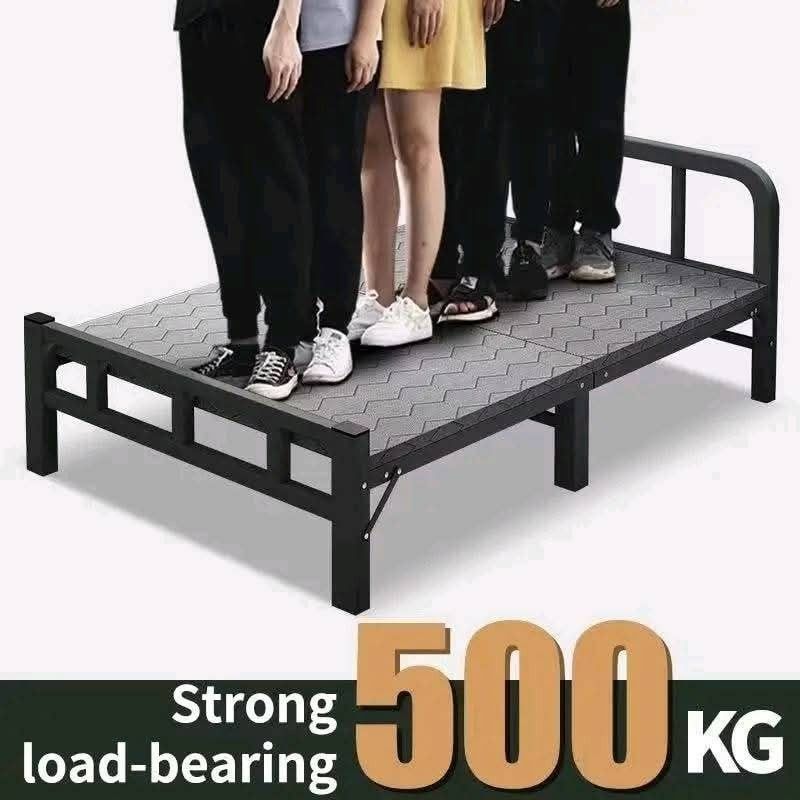 Foldable Metal Bed Frame (Category: Bed Frames & Mattresses) located in Manila. Submitted by haideee (Listing ID 1402384517, Image 2). Description: Foldable metal bed frame is designed with a strong load-bearing capacity of 500KG. It features a rounded corner design and tripod support for stability. The bed has a thickened bedside soft bag for added comfort. Dimensions are approximately 186cm in length and available in widths of 75/80/90/100/120c