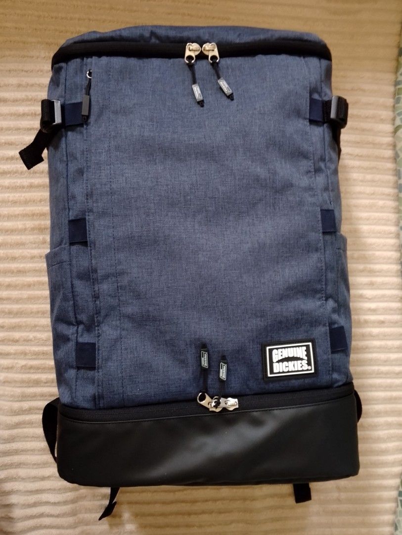 Genuine Dickies Big Backpack (Category: Backpacks) located in Binangonan. Submitted by stufflikedat (Listing ID 1402367711, Image 1). Description: Genuine Dickies 73-17 big & square 2-layer backpack for commuting travelling school work or gym with shoes compartment, denim ash blue polyester material in excellent pre-loved condition, all zippers are intact no tear or loose threads, approx height 20.5" x width 13" x depth 6.9" 5 pockets (4 exterior