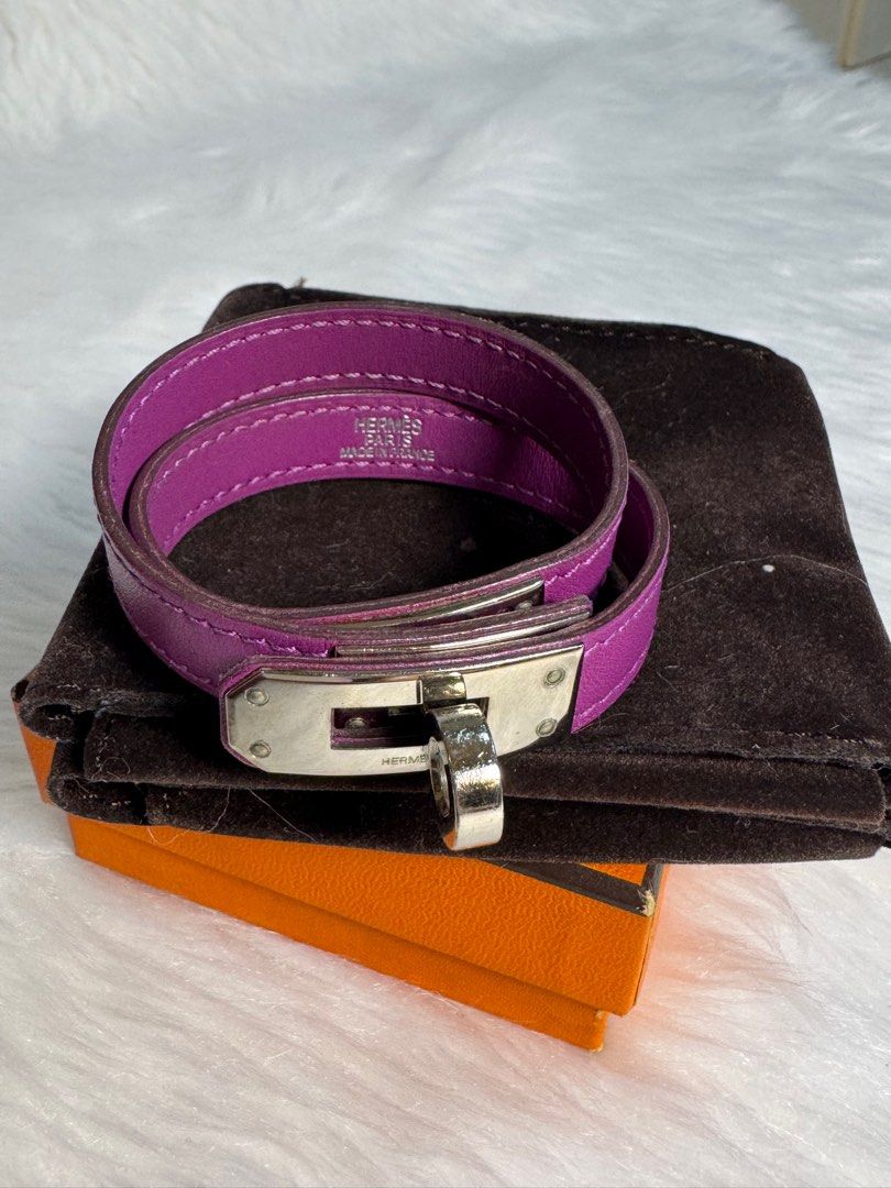 Hermes Kelly Double Tour Bracelet (Category: Luxury Accessories) located in San Juan City. Submitted by seeclosetfinds (Listing ID 1402416069, Image 1). Description: Authentic Hermes Kelly Double Tour bracelet in a vibrant purple color. Features a silver-tone clasp closure. Includes the original box and dust bag. The bracelet is a wrap-around style. Made in France..