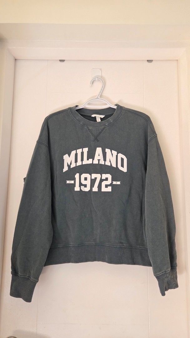 H&M green Milano 1972 Sweatshirt (Category: Longsleeves) located in Pasig City. Submitted by itsmecchai (Listing ID 1402471515, Image 1). Description: - Crew neck design - Long sleeves - Features "MILANO - 1972" print - Ribbed cuffs and hem - small on tag, loose fit.
