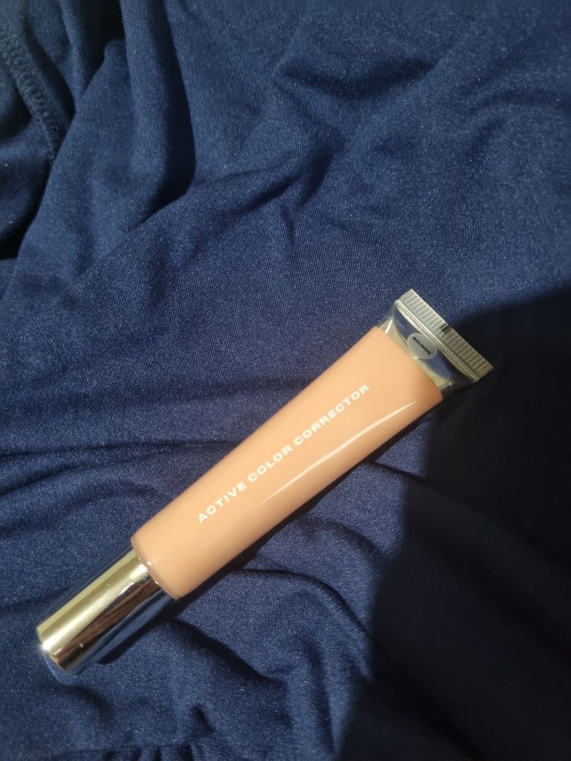 Issy & Co. Active Color Corrector - Salmon (Category: Makeup) located in Pasig City. Submitted by jrthashi (Listing ID 1402292153, Image 3). Description: Issy & Co. Active Color Corrector in Salmon shade. This product is designed to correct skin tone. The tube is a peach color with silver accents. The product name and shade are clearly visible on the packaging..