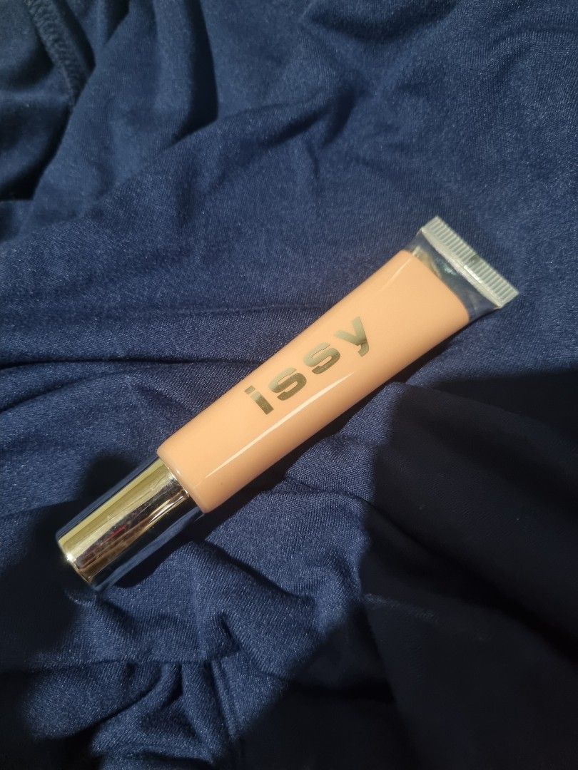 Issy & Co. Active Color Corrector - Salmon (Category: Makeup) located in Pasig City. Submitted by jrthashi (Listing ID 1402292153, Image 2). Description: Issy & Co. Active Color Corrector in Salmon shade. This product is designed to correct skin tone. The tube is a peach color with silver accents. The product name and shade are clearly visible on the packaging..