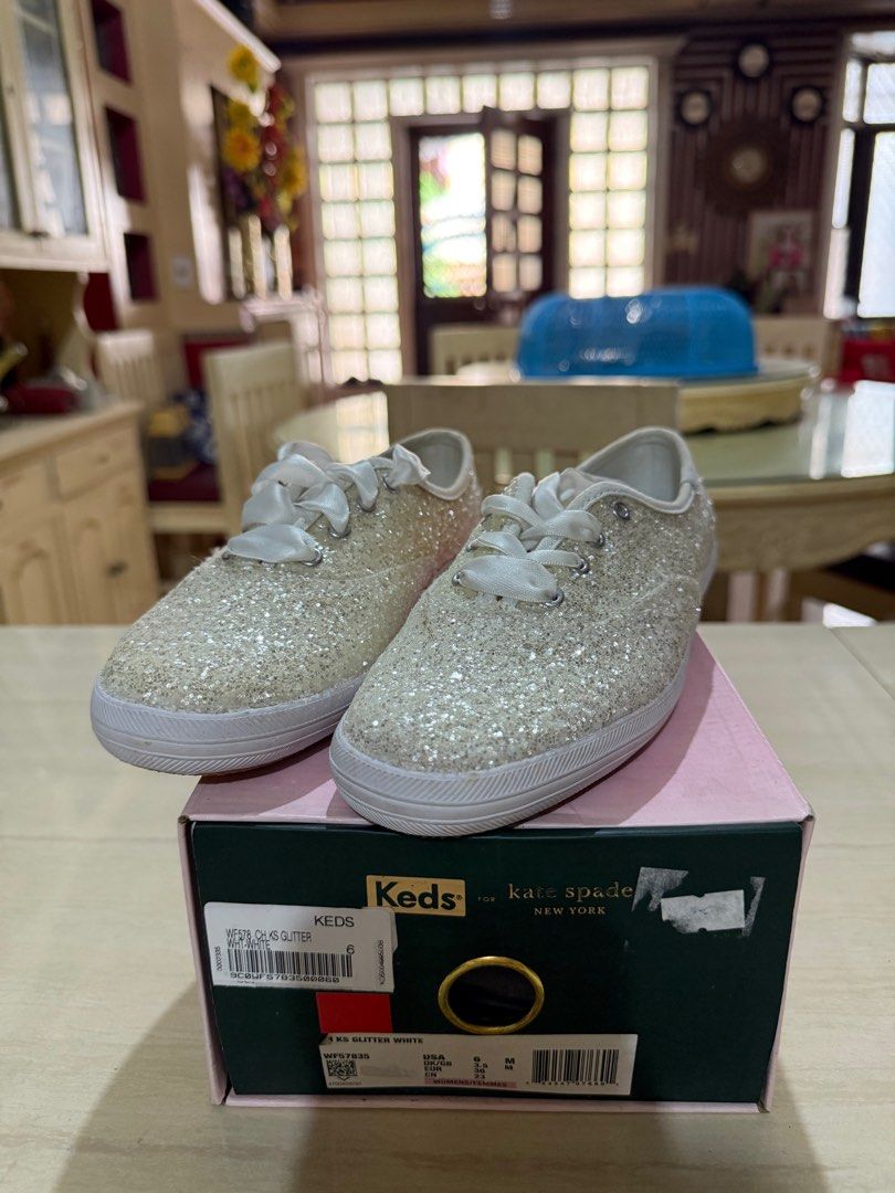 Keds x Kate Spade Glitter Sneakers (Category: Sneakers) located in Paranaque City. Submitted by lovelea (Listing ID 1402344515, Image 2). Description: Sparkling white Keds x Kate Spade sneakers. Features glitter detailing and ribbon laces Comes with the original box Original price 4995 NEW. Only used for fitting- never worn outside. Rfs: decluttering, too many sneakers.