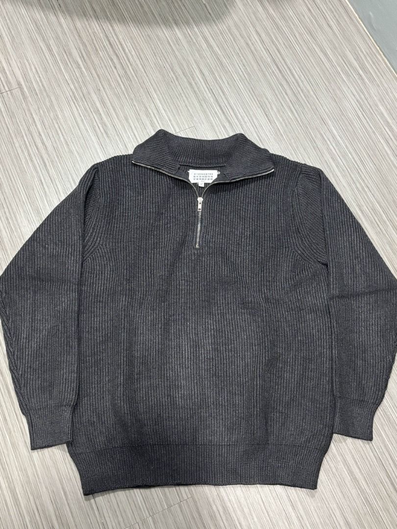 Maison Margiela Quarter Zip (Category: Luxury Apparel) located in Pasig City. Submitted by luxproducs (Listing ID 1402384167, Image 2). Description: - Maison Margiela Quarter Zip Sweater - Dark gray color - Ribbed knit texture - Bought in France resell store - Rare piece - No Issues Pm for measurements.