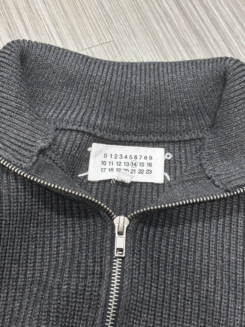 Maison Margiela Quarter Zip (Category: Luxury Apparel) located in Pasig City. Submitted by luxproducs (Listing ID 1402384167, Image 3). Description: - Maison Margiela Quarter Zip Sweater - Dark gray color - Ribbed knit texture - Bought in France resell store - Rare piece - No Issues Pm for measurements.
