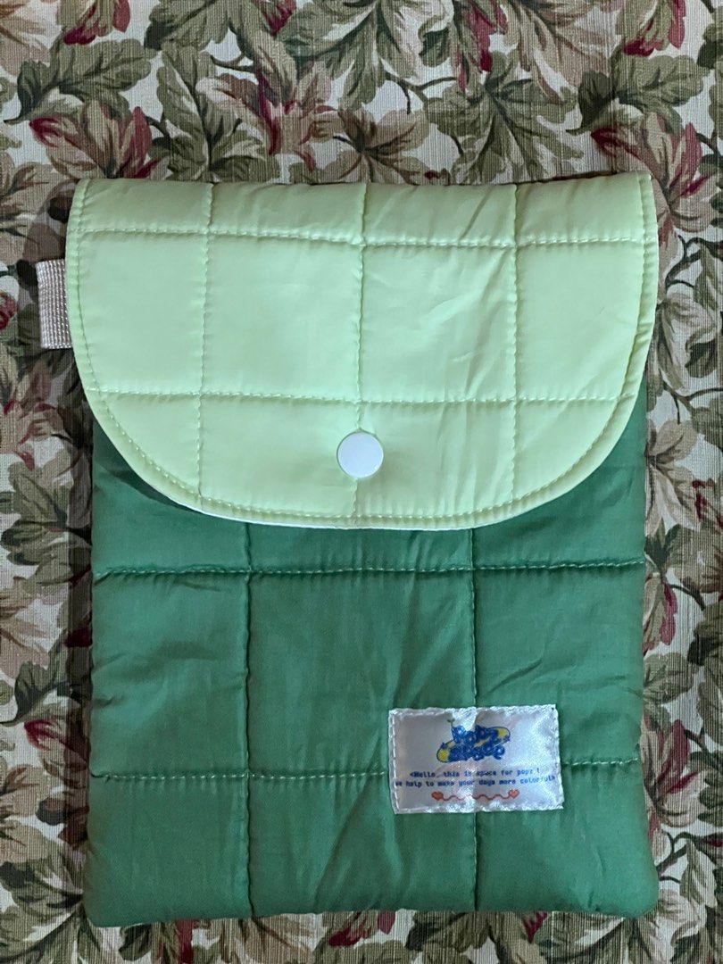 Matcha Green E-reader sleeve (Category: Laptop Bags & Sleeves) located in Quezon City. Submitted by chibichuckie (Listing ID 1402356767, Image 2). Description: - Quilted e-reader sleeve (for kindle/kobo) - Two-tone green color - Padded design for protection - Secure flap closure with button - Brand new, unused, no issues - Purchased on the orange app for 398 - RFS: getting this in a different color cause the color i truly want is now in stock! sa
