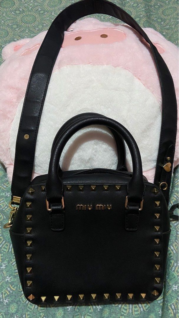 Miu Miu Black Studded Handbag With Sling (Category: Luxury Bags & Wallets) located in Talavera. Submitted by thr1ftyren (Listing ID 1402436620, Image 1). Description: Baka may looking po nito🚨 Miu Miu 2 way handle/sling leather bag Excellent condition Color rate 9.8/10 No issues Mine 1300 + sf Dm to purchase📥 📍Location Nueva Ecija.