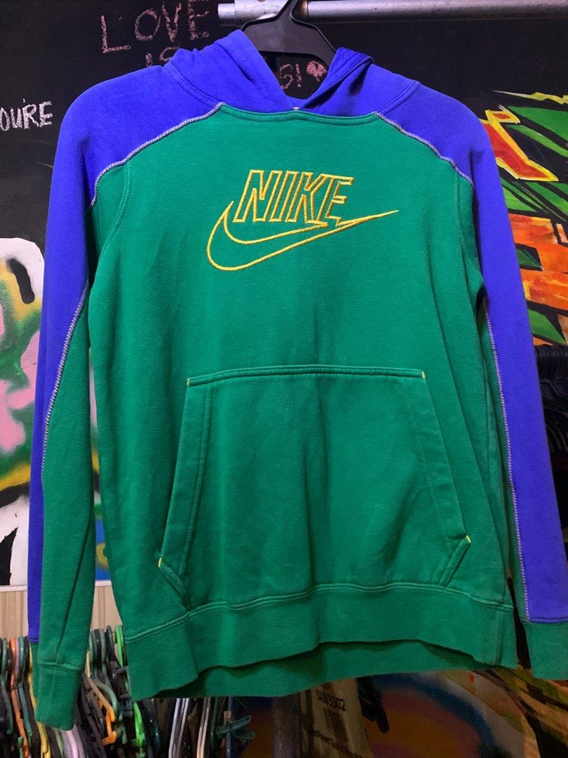 Nike Hoodie Green Blue Medium (Category: Hoodies) located in Angeles City. Submitted by danedane06 (Listing ID 1402388418, Image 2). Description: Nike hoodie in green and blue colorway. Features a front pocket and a Nike logo embroidered in yellow. The hoodie has a hood and long sleeves. Size is Medium. Made in Jordan..