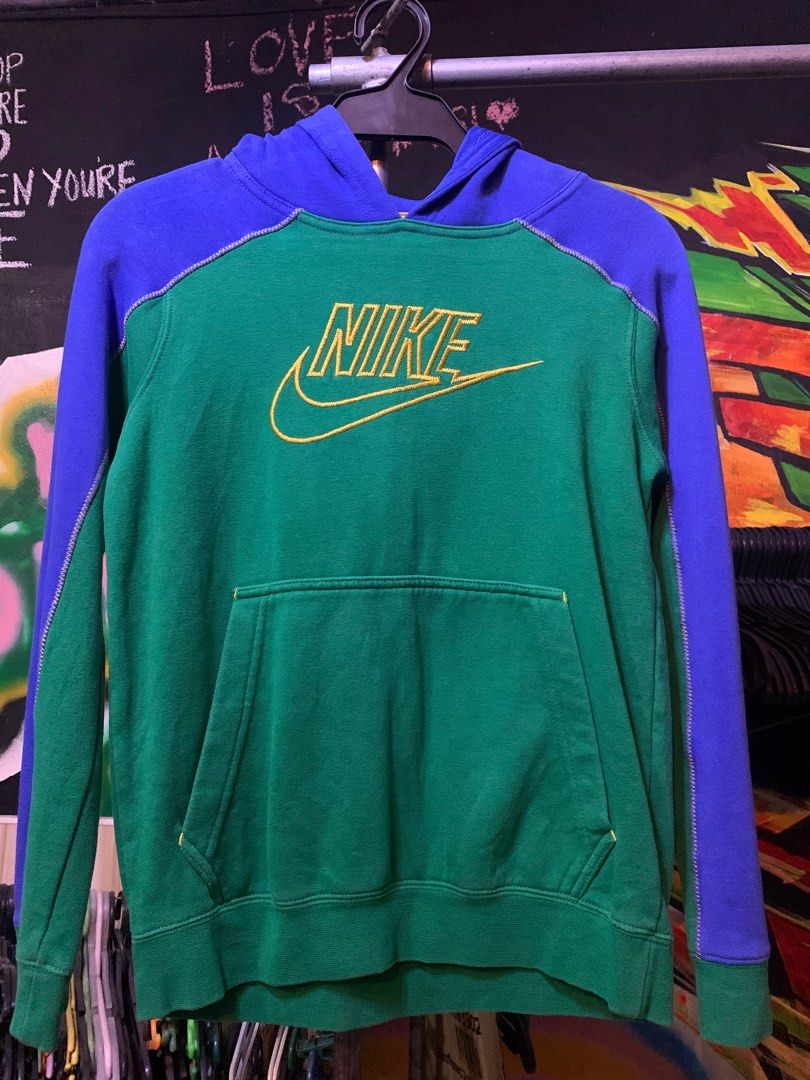 Nike Hoodie Green Blue Medium (Category: Hoodies) located in Angeles City. Submitted by danedane06 (Listing ID 1402388418, Image 1). Description: Nike hoodie in green and blue colorway. Features a front pocket and a Nike logo embroidered in yellow. The hoodie has a hood and long sleeves. Size is Medium. Made in Jordan..