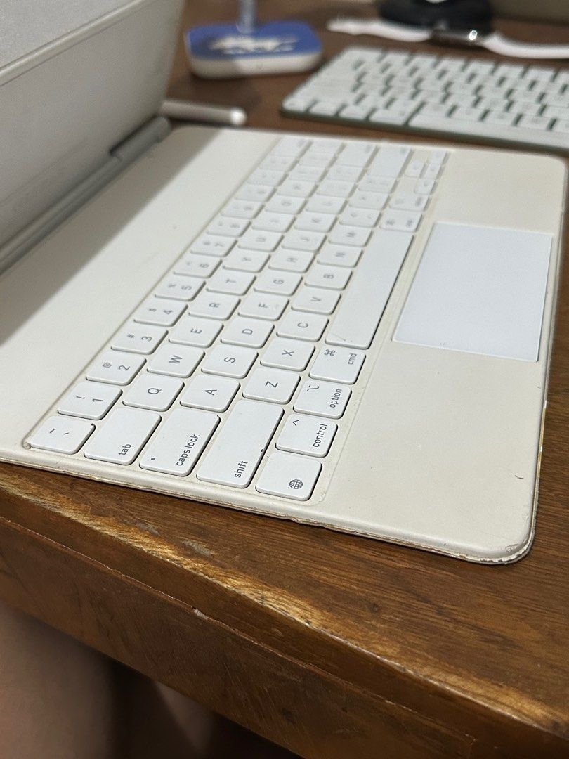 Original Apple Magic Keyboard for iPad Pro 12.9 M1 / M2 ( 3rd generation / 4th generation / 5th generation / 6th generation) (Category: Computer Keyboard) located in Manila. Submitted by razelysonn (Listing ID 1402385058, Image 3). Description: FIXED PRICE - selling low already - just needs cleaning as well all keys and trackpad working well Side by side posted :) location: Binondo Manila .