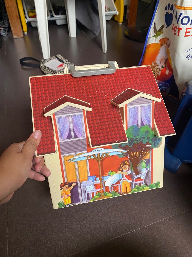 Playmobil Playhouse with Accessories (Category: Kids Toys) located in Pasay City. Submitted by tindarela (Listing ID 1402332550, Image 3). Description: - Playmobil Playhouse set - Includes figures and furniture - Features a red roof - Opens to reveal multiple rooms: kitchen, living room, bedroom - Encourages imaginative play What you see is what you get.