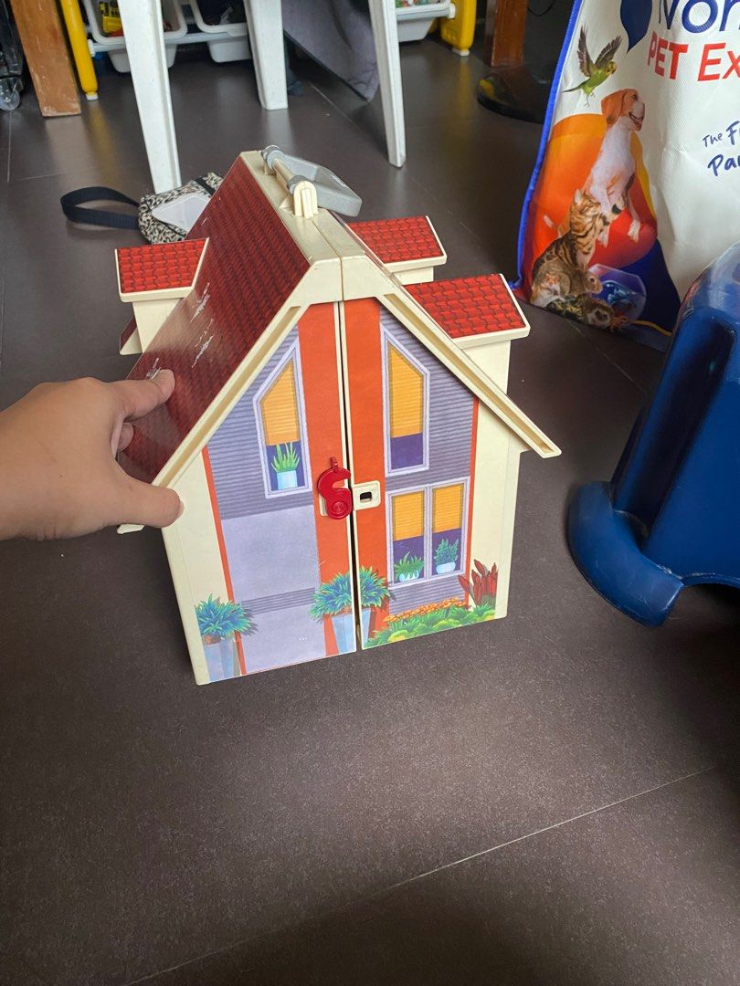 Playmobil Playhouse with Accessories (Category: Kids Toys) located in Pasay City. Submitted by tindarela (Listing ID 1402332550, Image 2). Description: - Playmobil Playhouse set - Includes figures and furniture - Features a red roof - Opens to reveal multiple rooms: kitchen, living room, bedroom - Encourages imaginative play What you see is what you get.