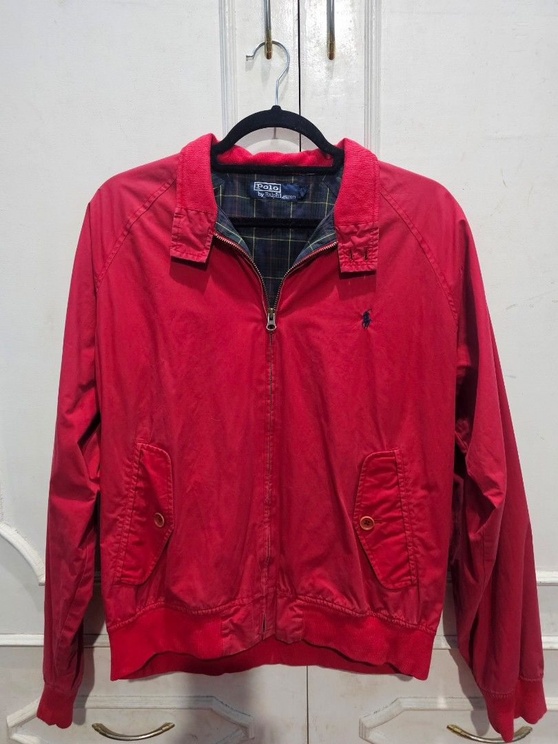 Vintage Ralph Lauren Red Harrington Jacket (Category: Coats, Jackets and Outerwear) located in Baguio. Submitted by frdptt (Listing ID 1402449405, Image 1). Description: - Polo by Ralph Lauren red jacket - Zip-up front - Classic collar - Two front pockets - Embroidered Polo logo - Plaid interior lining - Ribbed cuffs and hem • Issue on 4th picture • Made for japan-market Size on Tag: L Fits S-M (23x24).