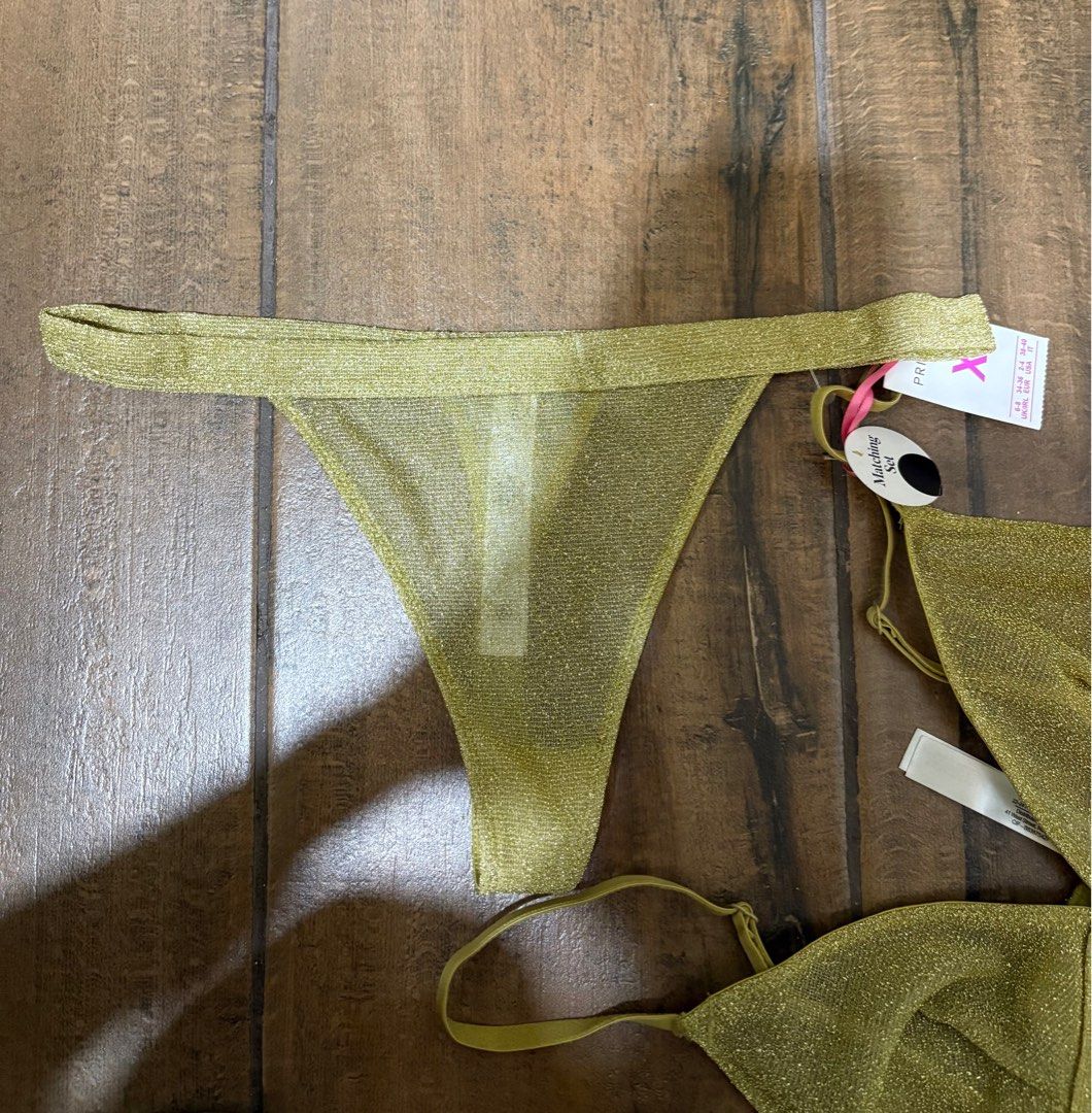Primark Matching Thong Set - XS (metallic gold) (Category: Bikinis & Swimsuits) located in Bacolod City. Submitted by nikituuuh (Listing ID 1402344004, Image 3). Description: - Primark gold matching thong set - Size: XS - Includes triangle top and thong bottom - Triangle top with thin straps - New with tags.