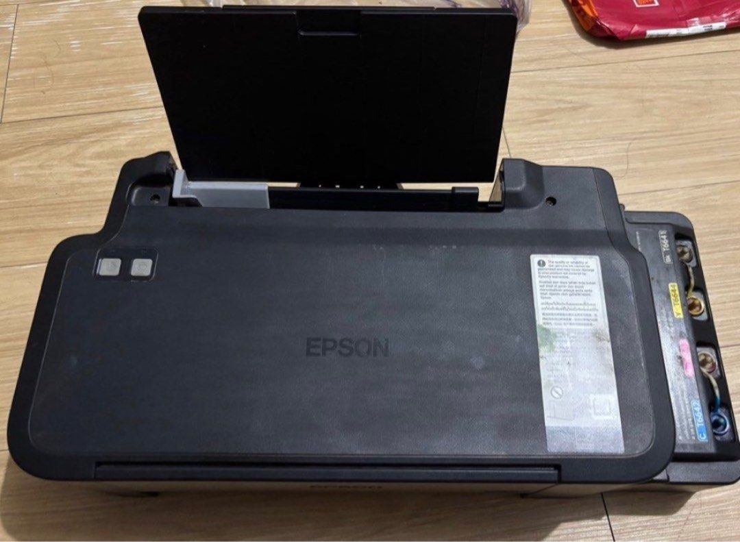 Printer Epson L120 (Category: Printers, Scanners & Copiers) located in Manila. Submitted by allysonorpia (Listing ID 1402364191, Image 2). Description: -REPOSTING- EPSON L120 - May ink pa - Complete cords pero wala na yung box RFS: Decluttering coz I need space + hindi na rin nagagamit Update!! May blinking red and green issue na ngayon 🥲 tried to fix it pero hindi ako ng makadownload ng resetter For pick up only Loc: Ermita Manila.