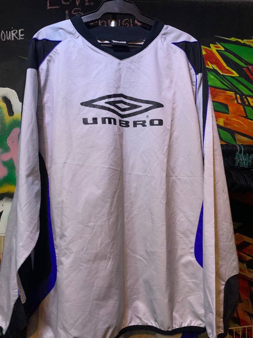 Umbro Motion Control Jacket (Category: Coats, Jackets and Outerwear) located in Angeles City. Submitted by danedane06 (Listing ID 1402389931, Image 1). Description: - Umbro Motion Control jacket - Color: White, black, and blue accents - Features Umbro logo - V-neck collar - Long sleeves - Size: see tag in photos - Model: UBS4822 - Made in China Issues: see last photos.