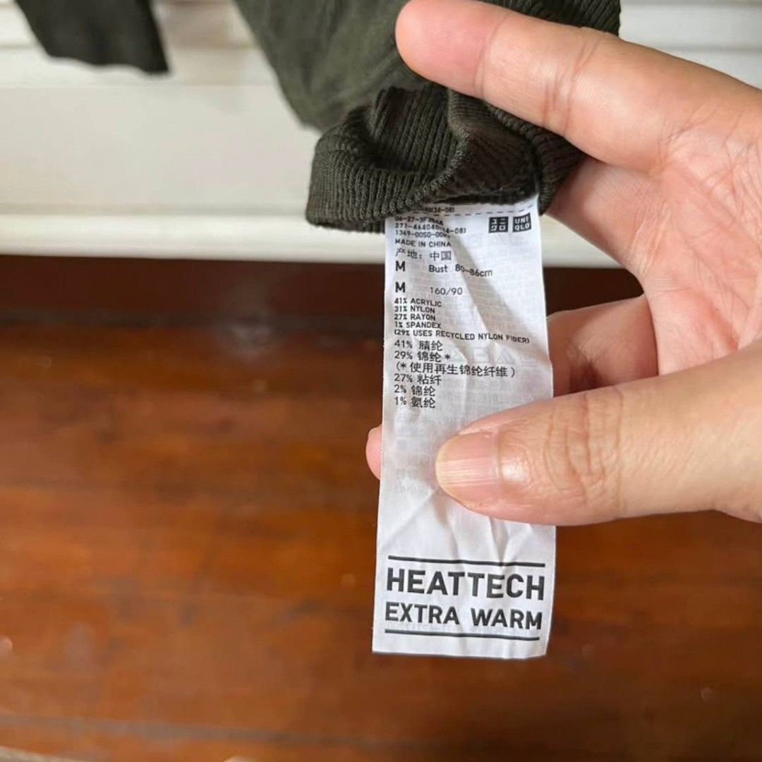 Uniqlo Heattech Extra Warm Striped Turtleneck (Category: Longsleeves) located in Marikina City. Submitted by senandash (Listing ID 1402300855, Image 2). Description: Uniqlo Heattech Extra Warm turtleneck sweater. Features a striped design with shades of green, blue, and black. It has a turtleneck collar and long sleeves. The size is M. Made with a blend of acrylic, nylon, and spandex. Perfect for staying warm during colder weather..