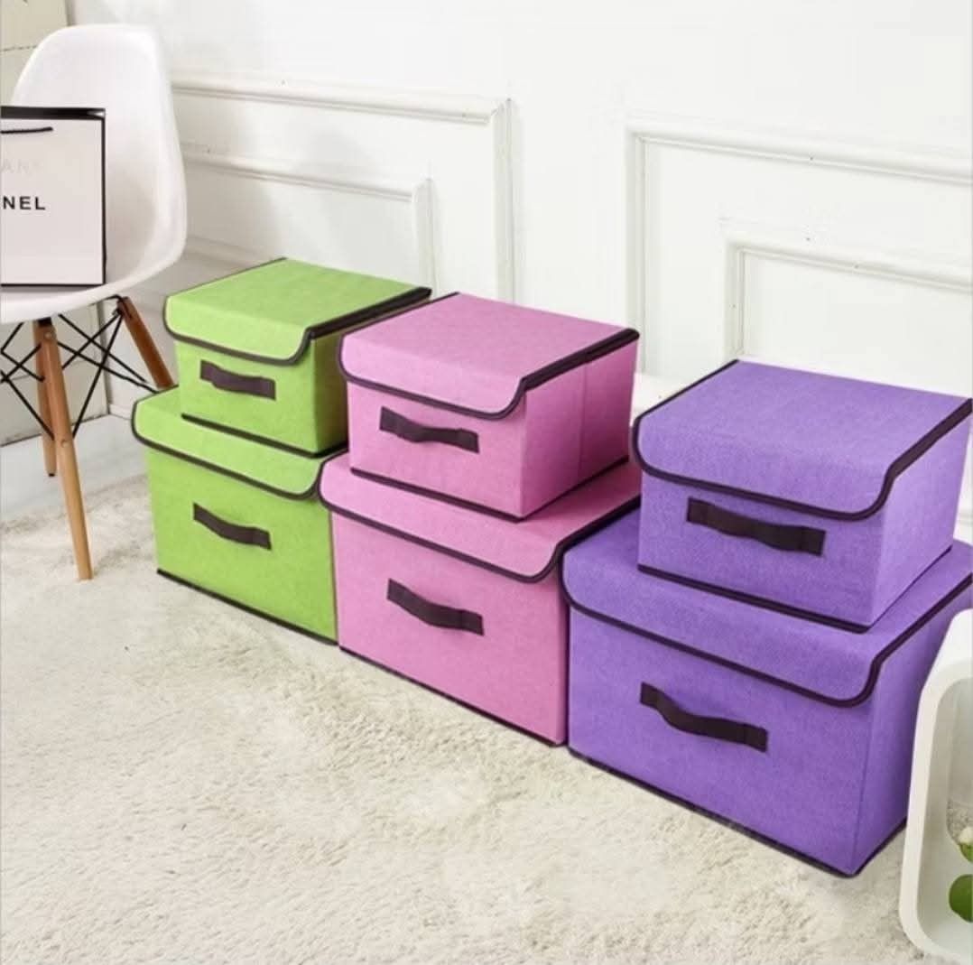 2in1 Clothes Storage Boxes with Lids (Category: Everything Else Others) located in Manila. Submitted by lyfrancois14 (Listing ID 1402523683, Image 2). Description: These storage boxes come in various colors and sizes, perfect for organizing clothes, toys, or other items. They feature lids and handles for easy access and portability. The boxes appear to be made of a durable fabric material and are designed to be collapsible when not in use, saving
