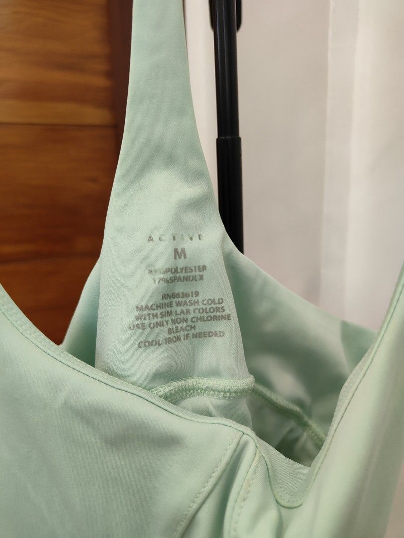 Active Sports Bra - Mint Green - Size M (Category: Activewear) located in Caloocan City. Submitted by cssasot (Listing ID 1402652171, Image 2). Description: - Mint green sports bra - Racerback style - Size M - Made of 88% polyester and 12% spandex - Machine washable - Wash with similar colors - Use non-chlorine bleach only - Cool iron if needed.
