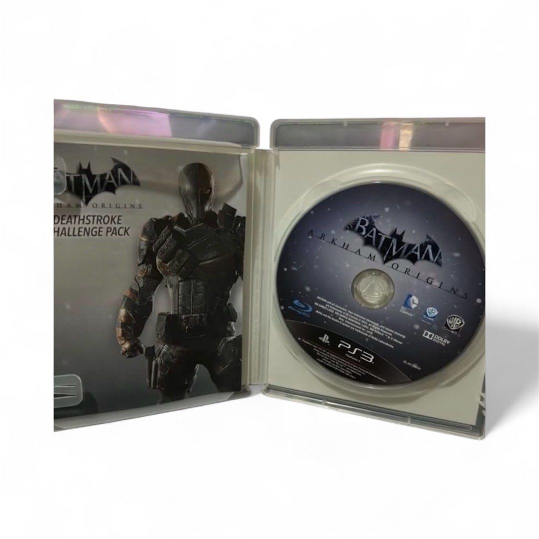 Batman: Arkham Origins - PS3 Game (Category: PlayStation) located in Pasig City. Submitted by johnlovesgaming (Listing ID 1402648118, Image 3). Description: Batman: Arkham Origins for PlayStation 3. Includes exclusive content like the Knightfall Batman Skin and Classic TV Series Batman Skin, plus 3 challenge maps. Features the Deathstroke Challenge Pack. Explore Gotham City and face Black Mask's assassins. Play as Batman and expand your arsenal..