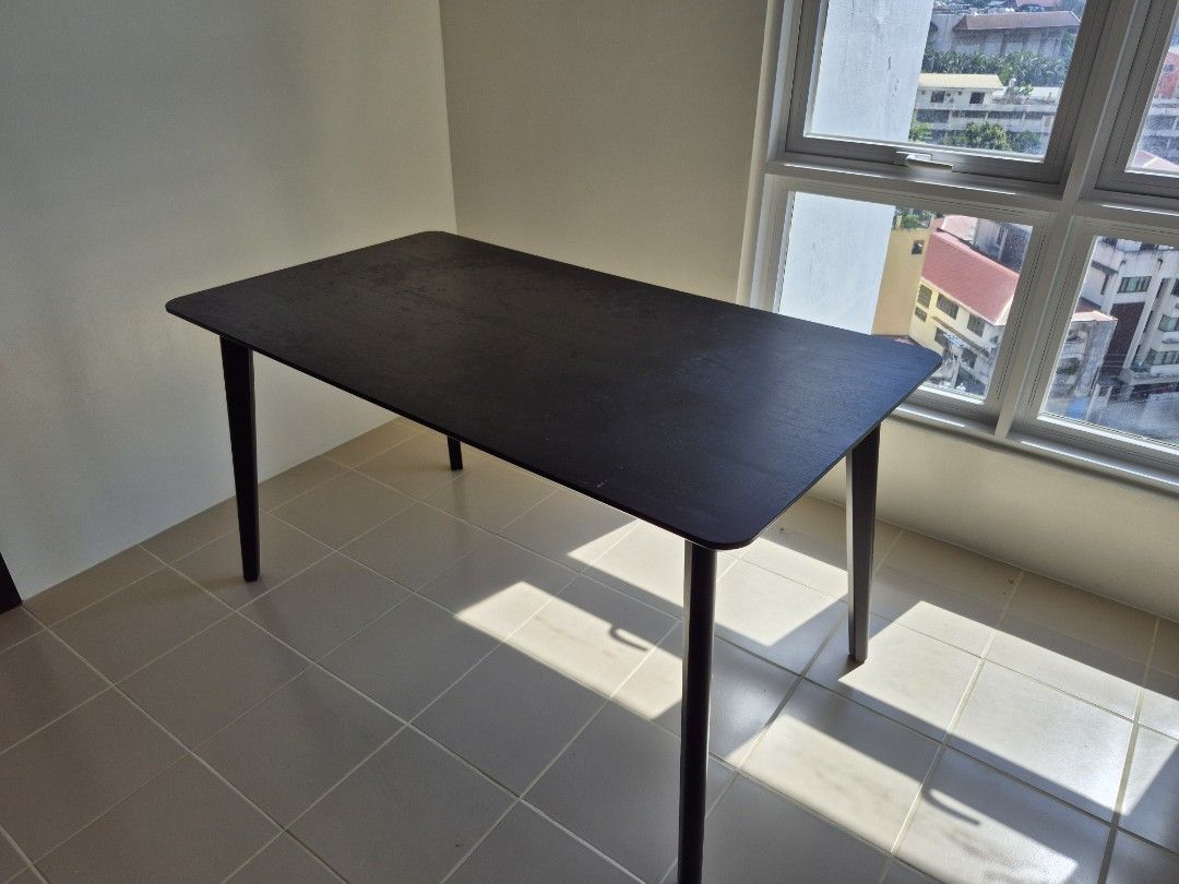 Dark Wood Dining Table, IKEA LISABO (Category: Tables & Sets) located in San Juan City. Submitted by freewind_3eb738 (Listing ID 1402570294, Image 3). Description: - Dark wood rectangular dining table. L 140cms W 75cms H 75cms. - Features four legs and rounded corners. easy to disassemble. - Suitable for small dining areas - Sturdy and well-maintained - Perfect for everyday use or entertaining - Simple, modern design.