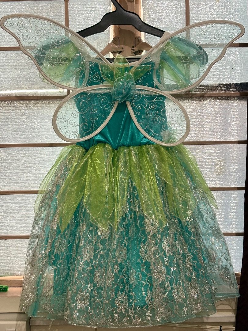 Fairy Costume with Wings (Category: Babies & Kids Fashion) located in Manila. Submitted by venuskithl83861 (Listing ID 1402485139, Image 2). Description: - Child's fairy costume - Teal bodice with white trim - Layered skirt: teal lace base with green and teal overlays - Includes matching fairy wings - Ideal for dress-up or themed parties.