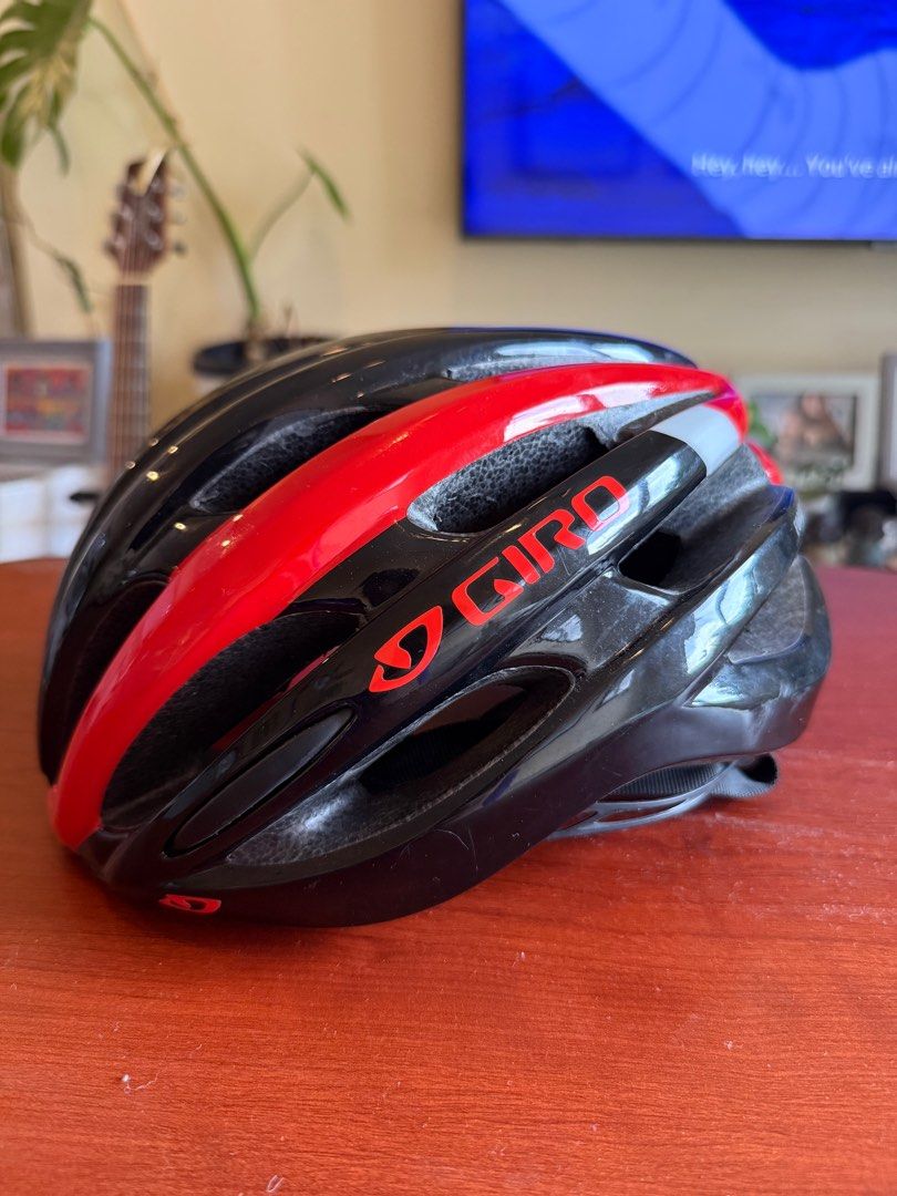 Giro Cycling Helmet (Category: Bicycles) located in Taguig. Submitted by gooosie (Listing ID 1402509966, Image 3). Description: - Giro cycling helmet - Black and red design - Multiple vents for airflow - Secure strap system - Giro logo visible.