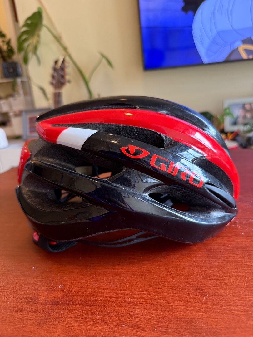 Giro Cycling Helmet (Category: Bicycles) located in Taguig. Submitted by gooosie (Listing ID 1402509966, Image 1). Description: - Giro cycling helmet - Black and red design - Multiple vents for airflow - Secure strap system - Giro logo visible.