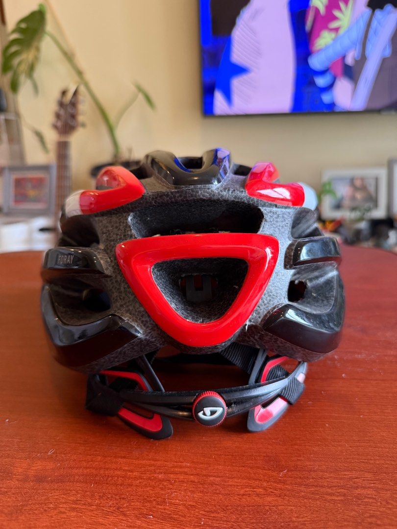 Giro Cycling Helmet (Category: Bicycles) located in Taguig. Submitted by gooosie (Listing ID 1402509966, Image 2). Description: - Giro cycling helmet - Black and red design - Multiple vents for airflow - Secure strap system - Giro logo visible.