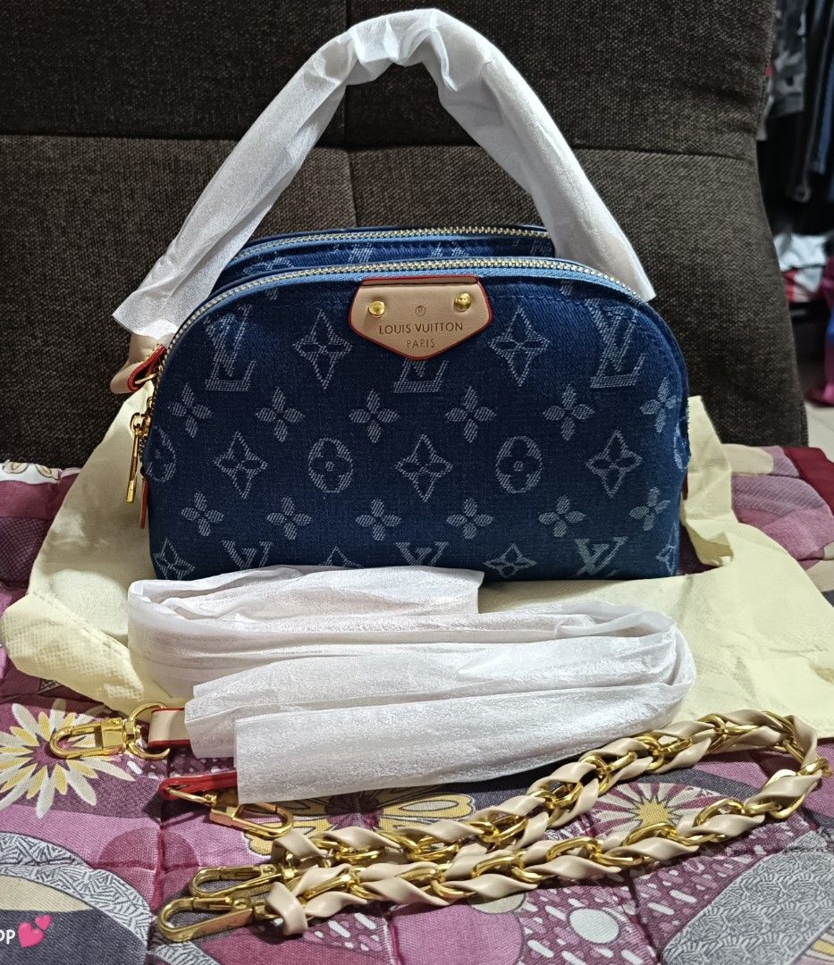Louis Vuitton Denim Crossbody Bag (Category: Luxury Bags & Wallets) located in Valenzuela. Submitted by AnahThrift (Listing ID 1402604755, Image 3). Description: - Authentic Louis Vuitton Crossbody Bag - Denim exterior with LV monogram - Dual-compartment design - Gold-tone zippers - Chain strap and detachable handle - Brown fabric interior - Includes brand label and serial number.