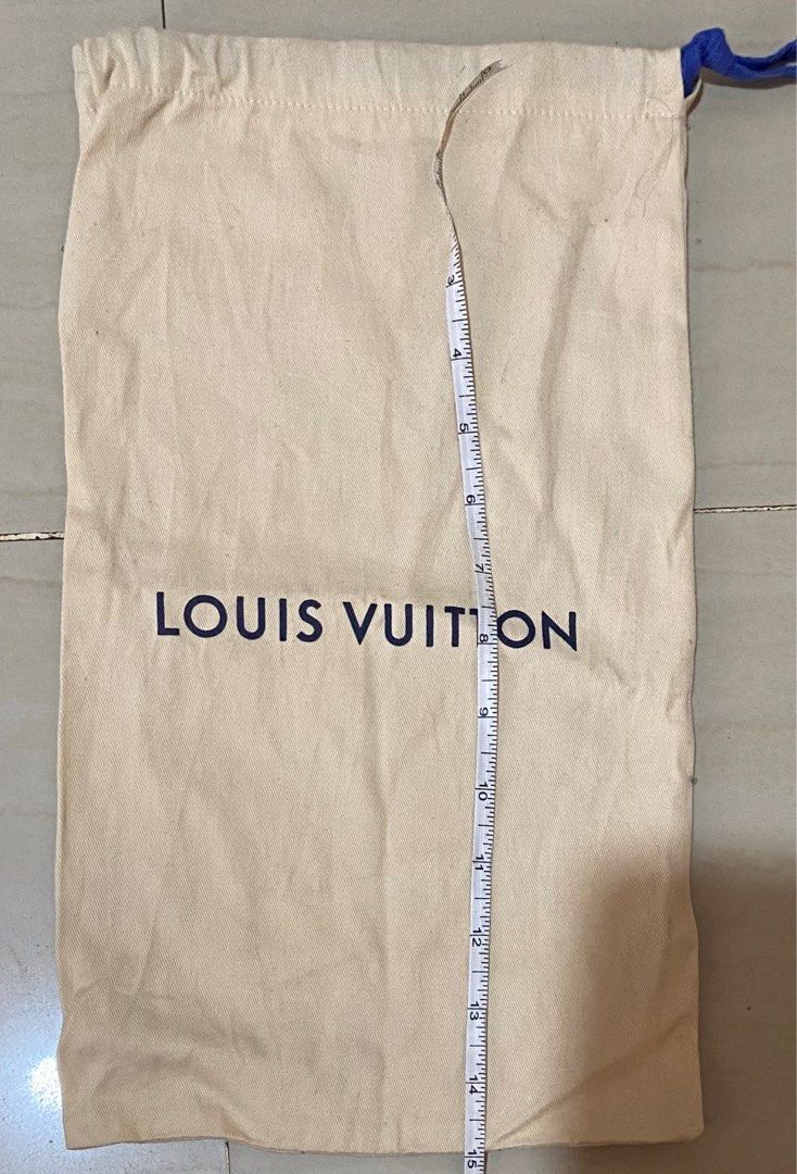 Louis Vuitton Dust Bag (Category: Luxury Bags & Wallets) located in Cagayan de Oro. Submitted by dandeshop (Listing ID 1402485858, Image 1). Description: Authentic Louis Vuitton dust bag. Made of cotton. Features the Louis Vuitton logo printed on the front. The bag measures approximately 15 inches in length and 10 inches in width. Includes a blue drawstring closure. The label indicates it was made in Italy..