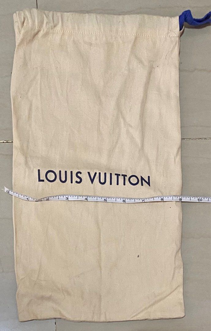 Louis Vuitton Dust Bag (Category: Luxury Bags & Wallets) located in Cagayan de Oro. Submitted by dandeshop (Listing ID 1402485858, Image 2). Description: Authentic Louis Vuitton dust bag. Made of cotton. Features the Louis Vuitton logo printed on the front. The bag measures approximately 15 inches in length and 10 inches in width. Includes a blue drawstring closure. The label indicates it was made in Italy..