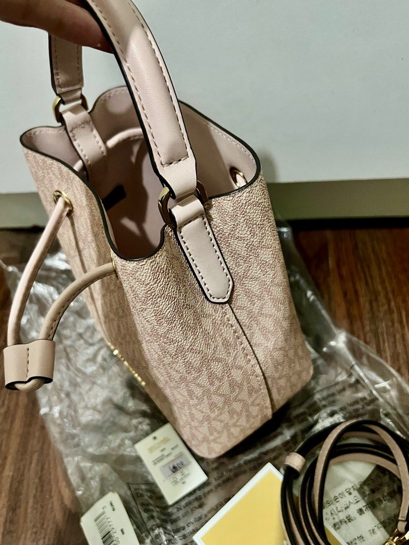 Michael Kors Suri Bucket Bag (Category: Luxury Bags & Wallets) located in Las Pinas. Submitted by myluckyeight (Listing ID 1402585337, Image 2). Description: Original and brand new with original plastic and tags Pink color With sling Mini bucket.