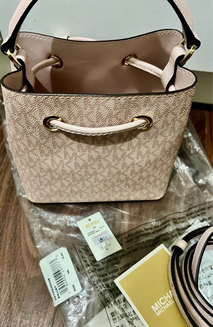 Michael Kors Suri Bucket Bag (Category: Luxury Bags & Wallets) located in Las Pinas. Submitted by myluckyeight (Listing ID 1402585337, Image 3). Description: Original and brand new with original plastic and tags Pink color With sling Mini bucket.
