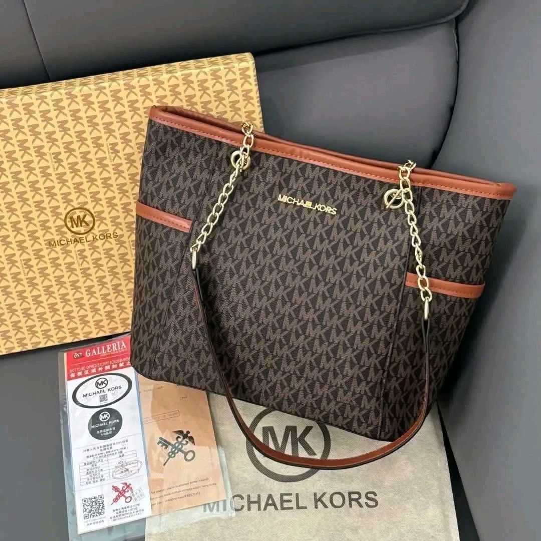 Michael Kors Tote Bag (Category: Luxury Bags & Wallets) located in Valenzuela. Submitted by AnahThrift (Listing ID 1402606115, Image 2). Description: - tote bag - Iconic pattern - Stylish chain strap - Multiple compartments for organization - Comes with dust bag and box - Available colors: beige, brown, black.