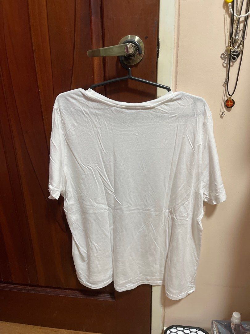 Monki White T-shirt - Size L (Category: Shirts) located in Antipolo. Submitted by j01000a (Listing ID 1402642032, Image 3). Description: - Monki white t-shirt - Size: L - Features: Round neckline, short sleeves - Made in Bangladesh - Lightweight and comfortable fabric - Versatile for various outfits.