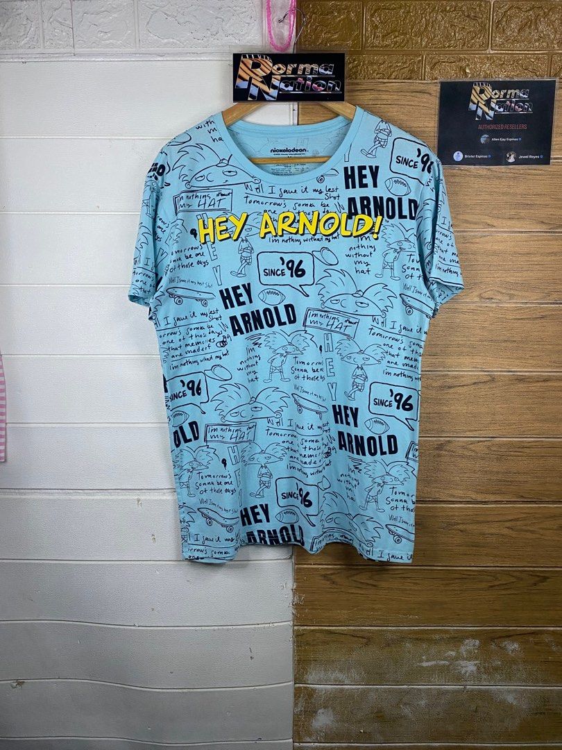NICKELODEON ALL OVER PRINT HEY ARNOLD! GRAPHIC TEE (Category: Tshirts & Polo Shirts ) located in Cabuyao City. Submitted by pormanation-thrift-store (Listing ID 1402527381, Image 1). Description: NICKELODEON ALL OVER PRINT SHIRT Condition: EXCELLENT Color rate: 9.5/10 Size: MEDIUM Dimes: 20.5"Wx27"L Issue: NONE‼️ Price: 350.