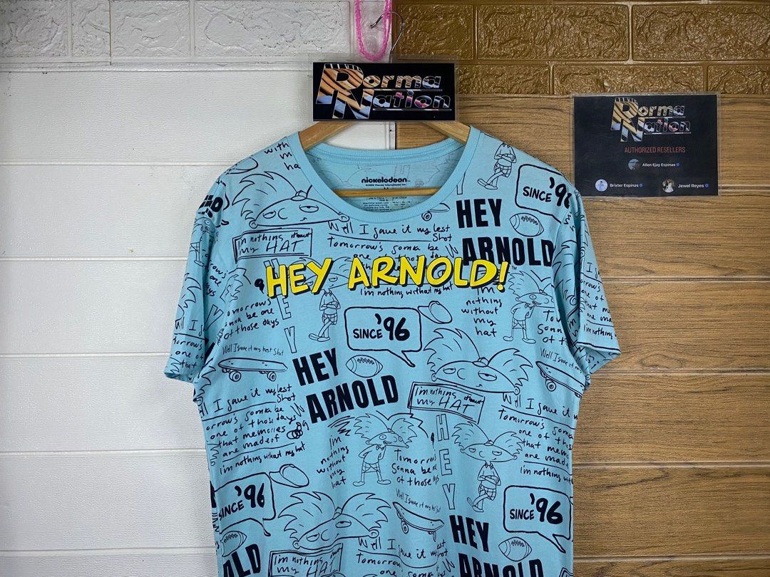 NICKELODEON ALL OVER PRINT HEY ARNOLD! GRAPHIC TEE (Category: Tshirts & Polo Shirts ) located in Cabuyao City. Submitted by pormanation-thrift-store (Listing ID 1402527381, Image 2). Description: NICKELODEON ALL OVER PRINT SHIRT Condition: EXCELLENT Color rate: 9.5/10 Size: MEDIUM Dimes: 20.5"Wx27"L Issue: NONE‼️ Price: 350.